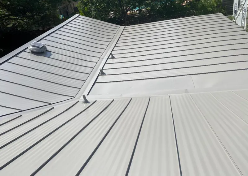 Solar attic fan installed on a metal roof for Roof Ventilation in Lake Wales